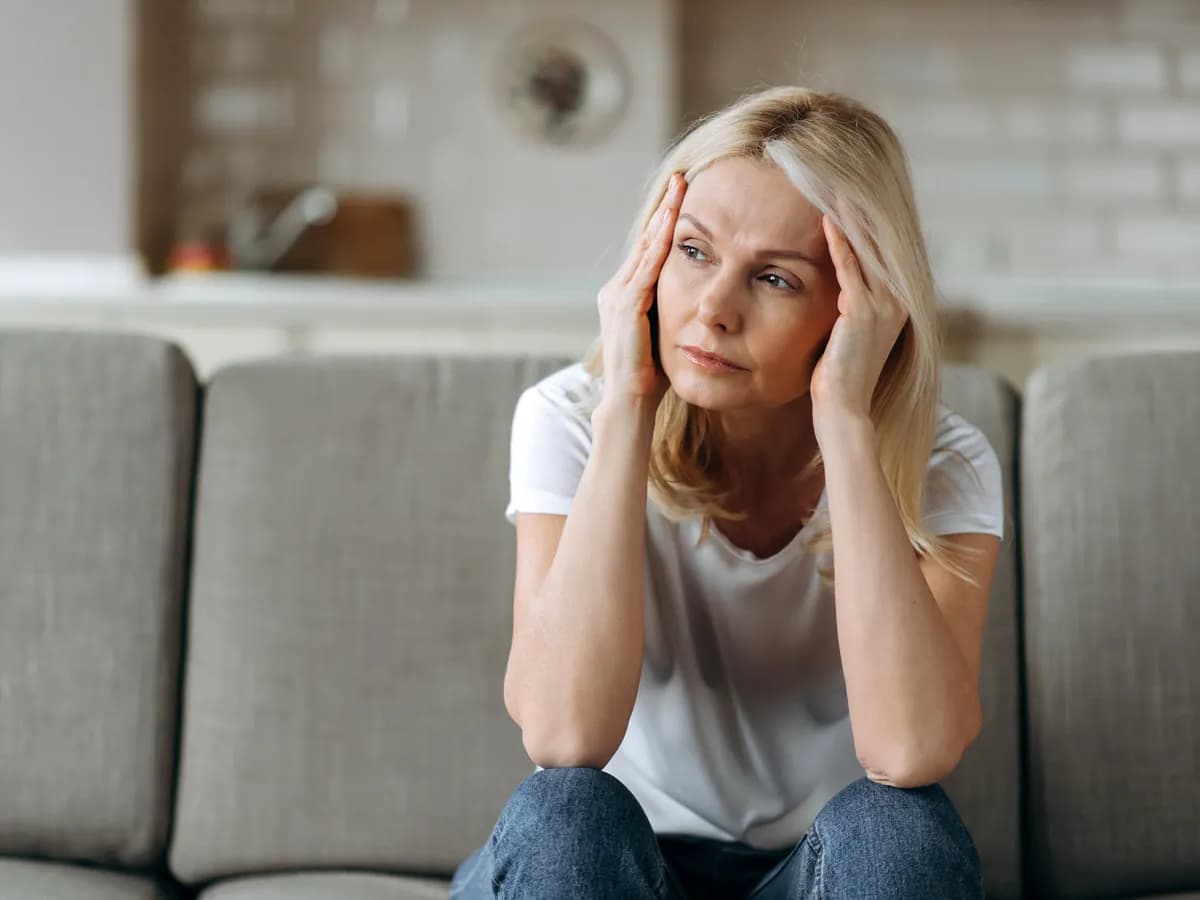 Woman in a reflective therapy session exploring inner parts